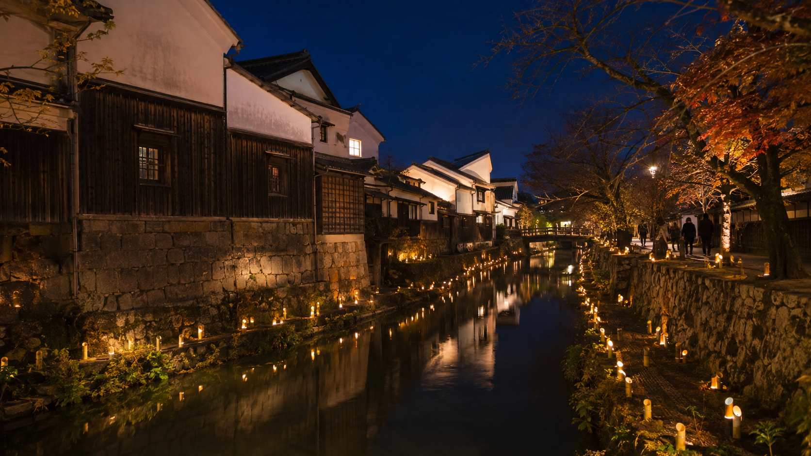 竹灯りが水面に映る夜の八幡堀と町並み