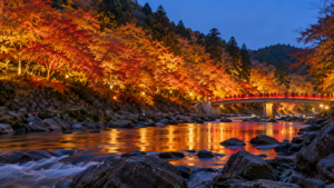 香嵐渓の巴川と赤い待月橋、照明に浮かぶ紅葉を参考にした編集用AI生成画像